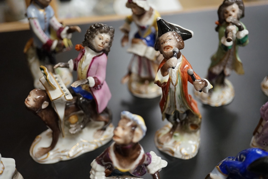 A group of twenty German porcelain monkey band figures, largest 15.5cm high